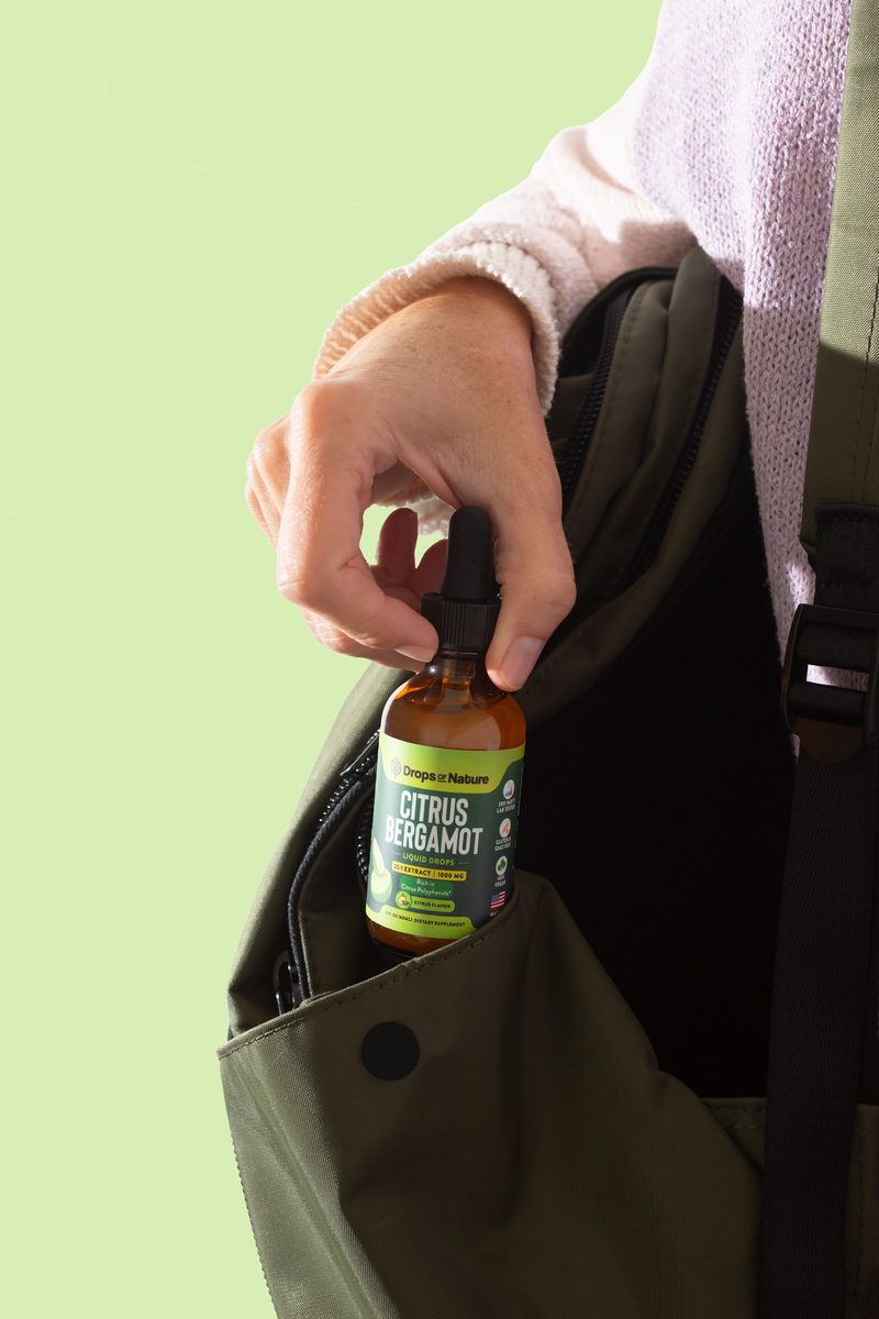 A bottle of Citrus Bergamot drops in a tote bag, ready to go.