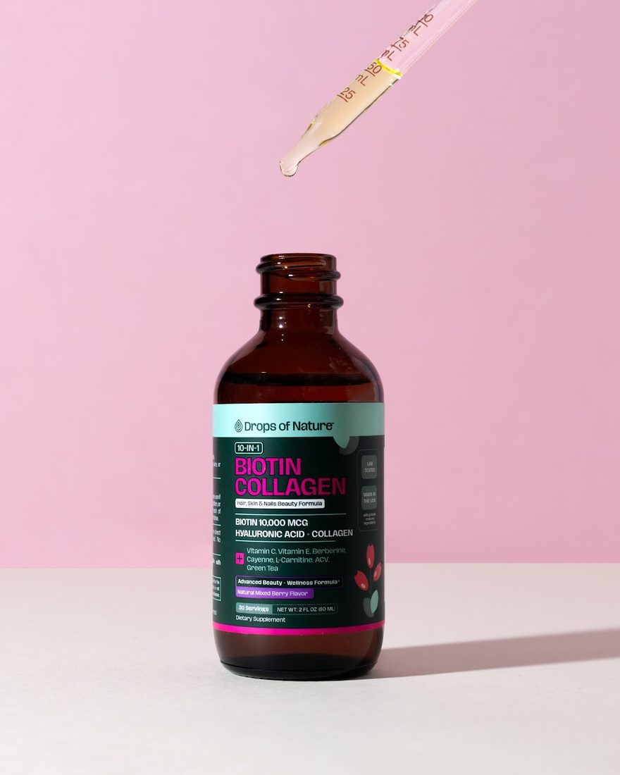 A dropper of Biotin Collagen drops over the open bottle