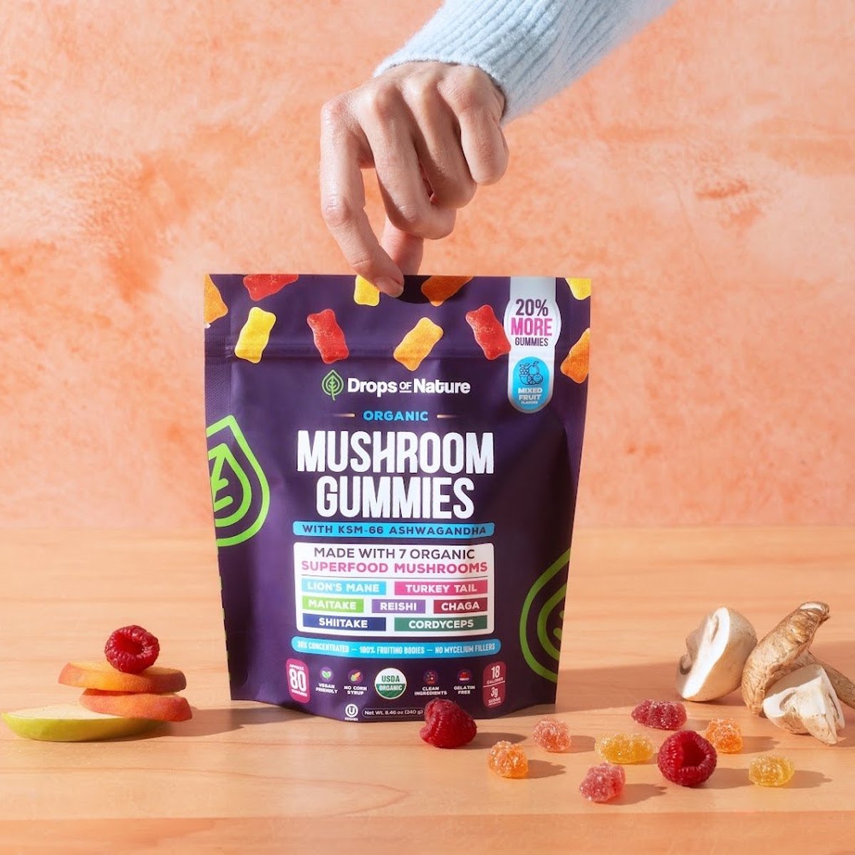 Organic Mushroom Gummies bag with fresh mushrooms.