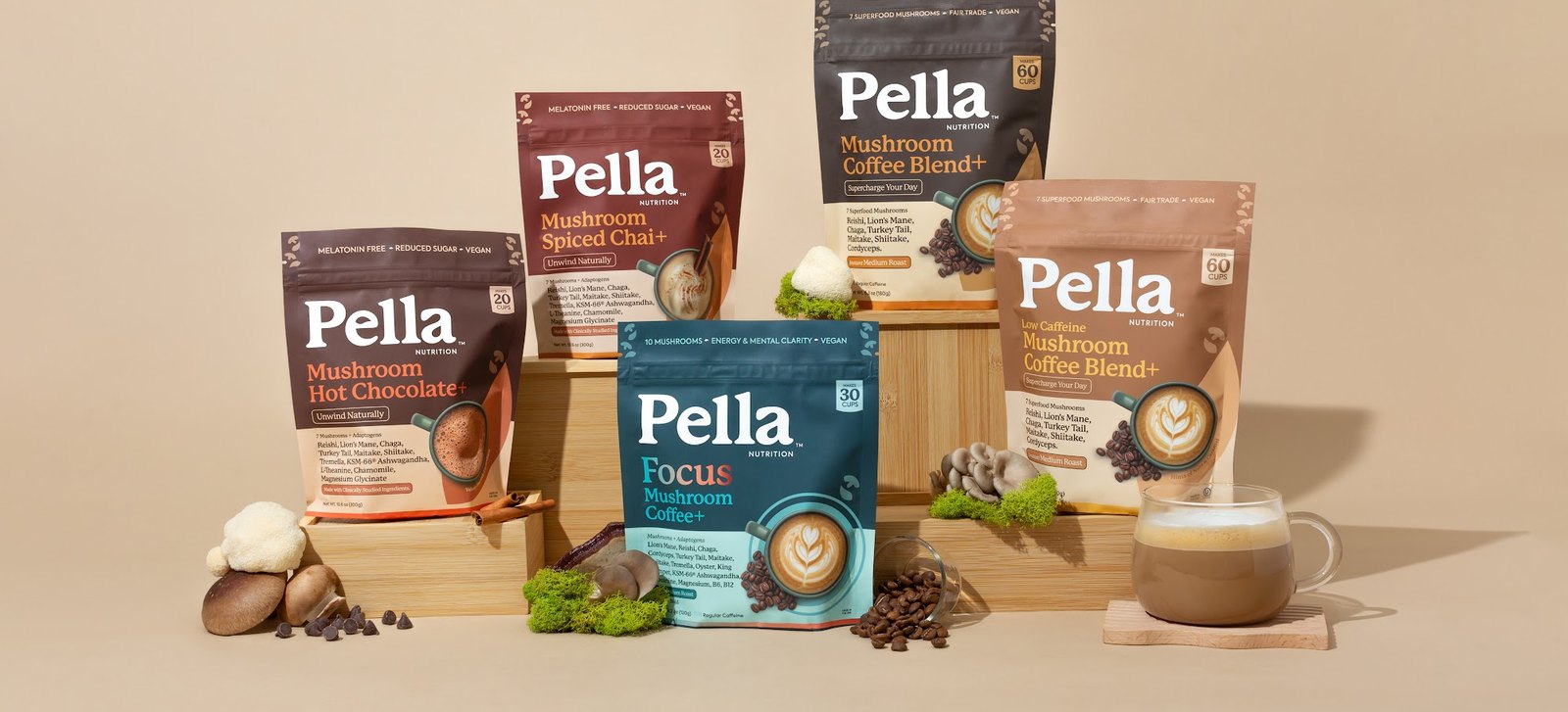 The Pella lineup: Hot Chocolate, Focus, Regular, Low Caffeine and Spiced Chai bags with cups and mushrooms