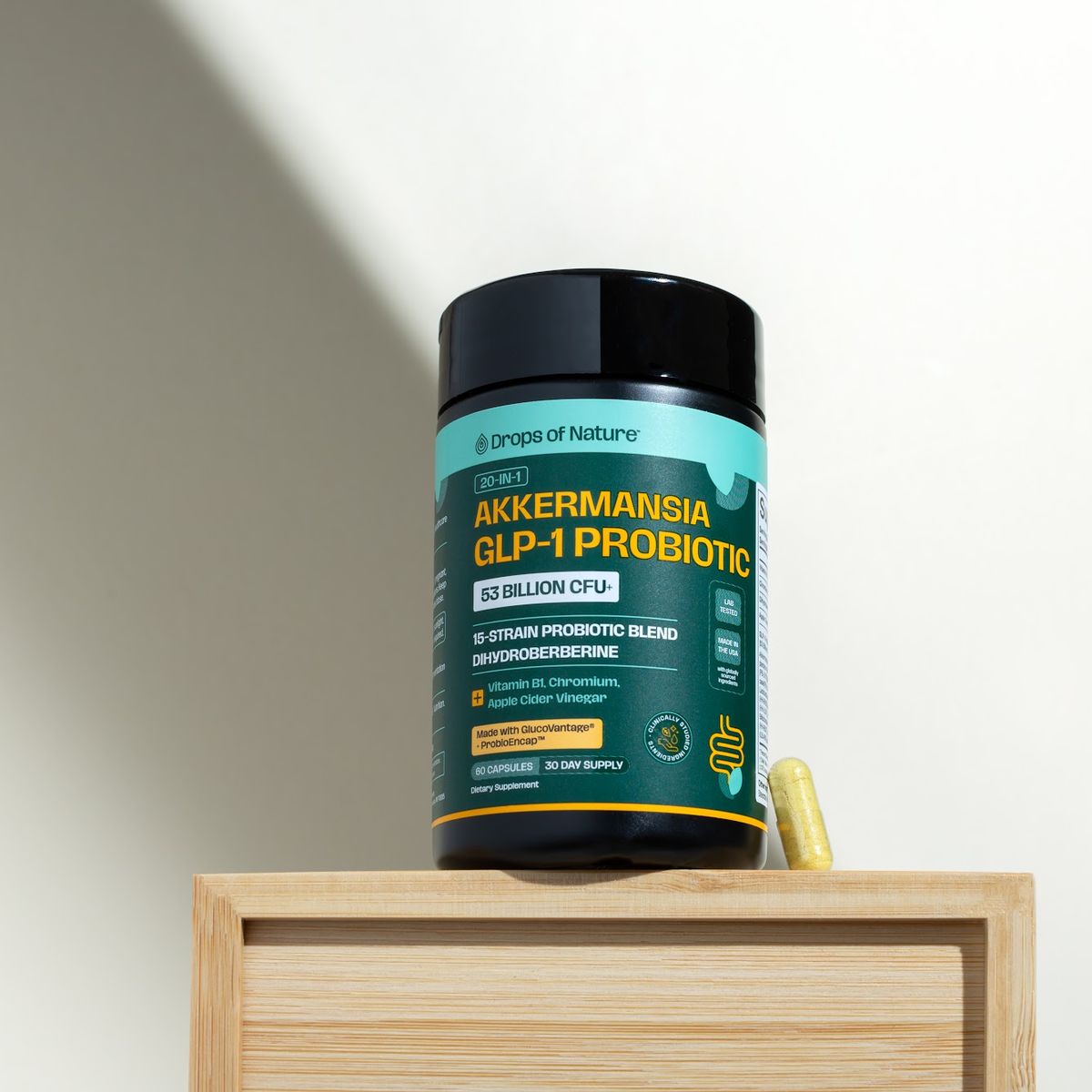 Akkermansia GLP-1 Probiotic bottle standing on a wooden box.
