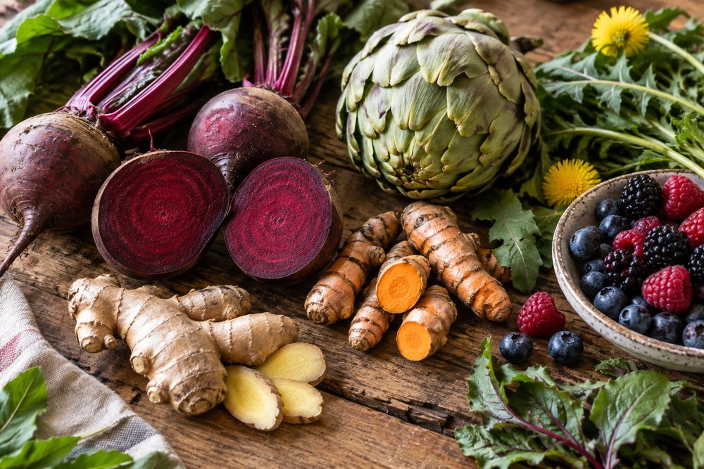 Beets, artichoke, turmeric and ginger on a table