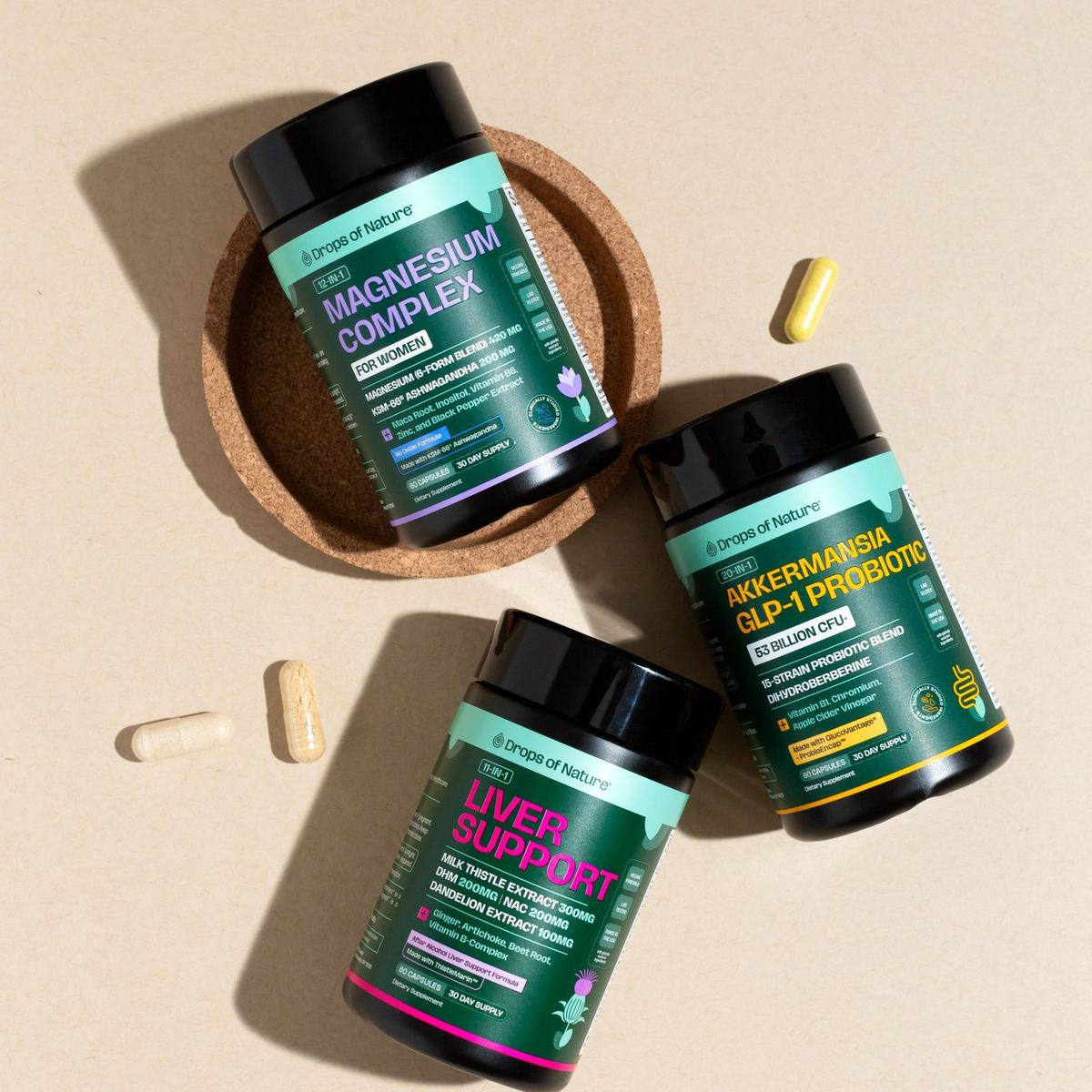 Drops of Nature Magnesium Complex, Akkermansia GLP-1 and Liver Support capsule bottles from above