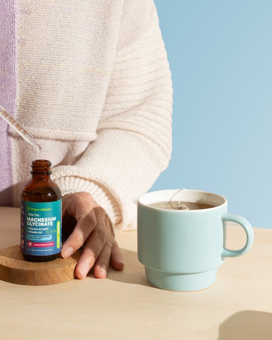 Magnesium + D3 & K2 drops going into a mug of tea