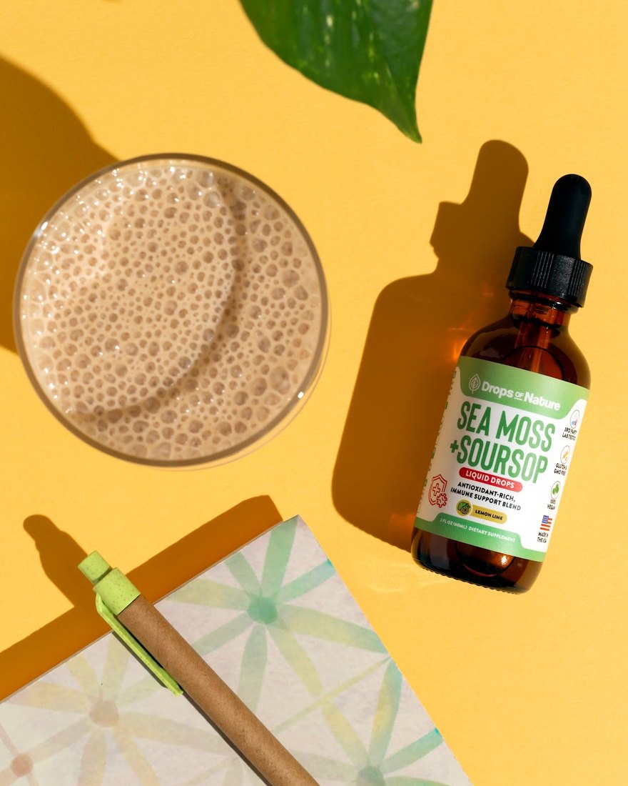 Soursop + Sea Moss drops beside a smoothie