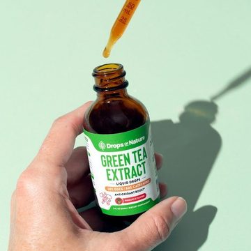 Green Tea Drops bottle in hand
